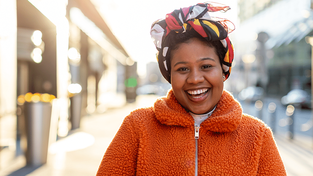 Woman in orange coat.