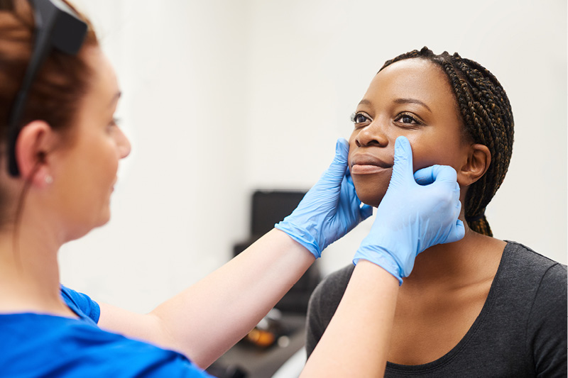 aesthetic care looking at patient's skin